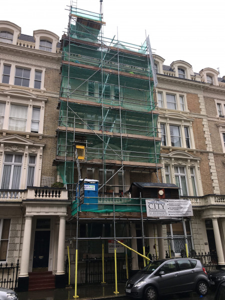 The front elevation of a block of flats in Notting Hill with scaffold in situ.