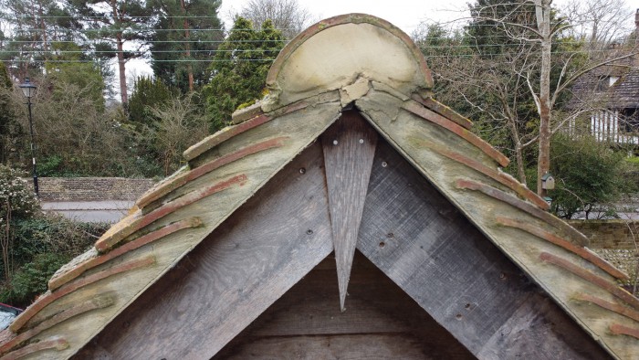 Photograph taken by a drone of wooden gable on garage roof